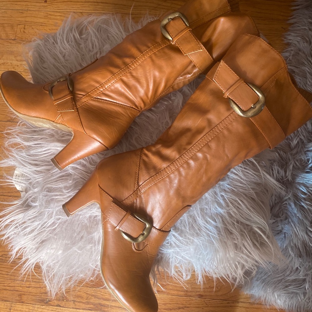 Leather like brown boots with small heel.